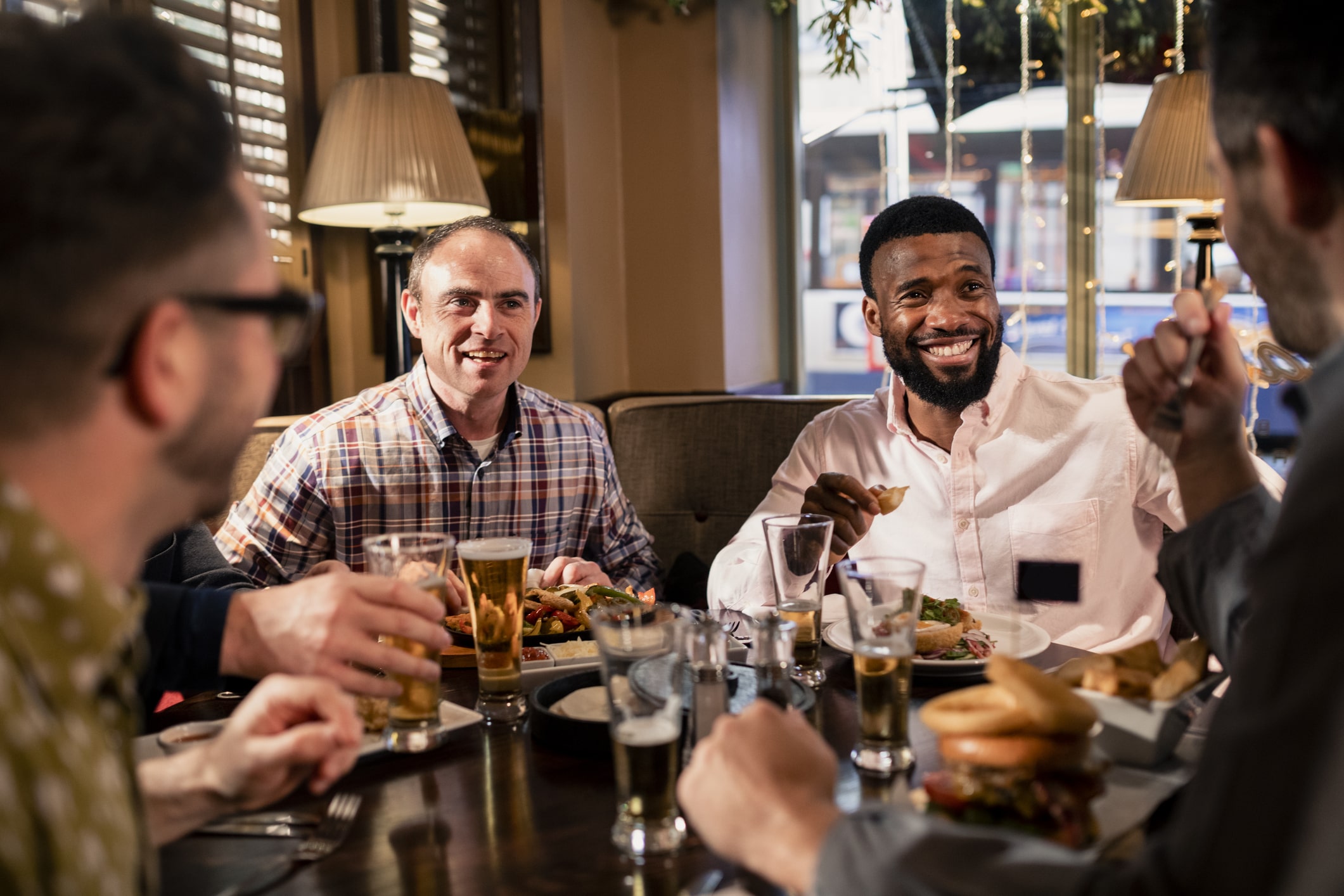 male friends eating together